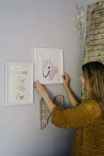 Load image into Gallery viewer, Unicorn artwork being hung on a wall 
